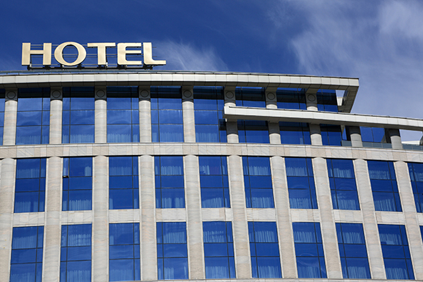 hotel building multi-level blue skies big sign